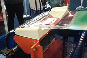 Optim'Protec-TT: nip-point guard for the head pulley, shown on an exhibition stand